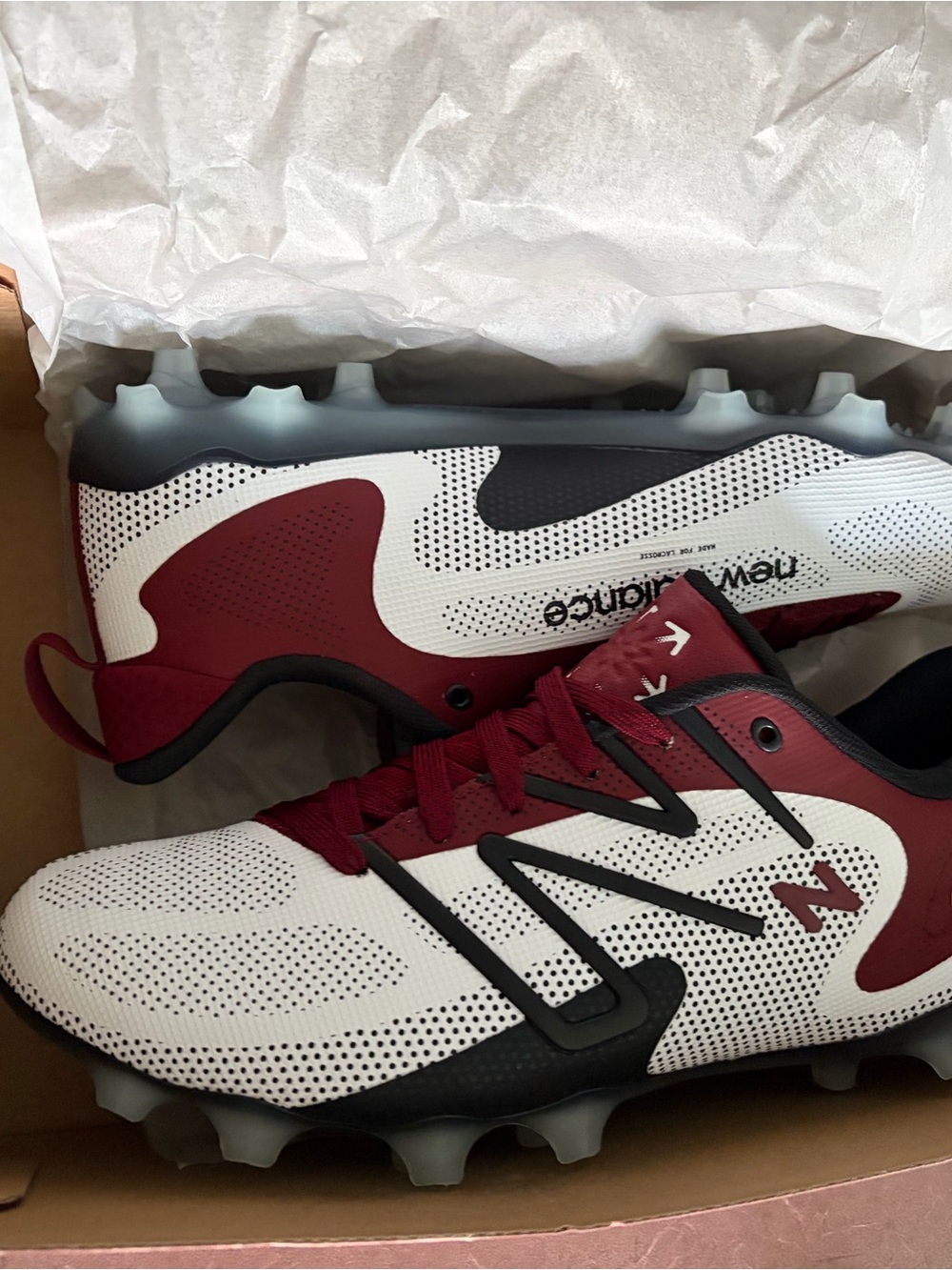 New Balance Men's FreezeLX V4 Low lacrosse cleats in white with maroon